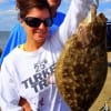 The Beaumont fishing team of Amy and Mike Percival heft this nice flounder caught on a Berkley Gulp