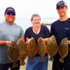 The family that wades together- fishes together- as the Escargno Family of Winnie TX did to catch these nice limits of flounder on Berkley Gulp