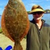 Vickie Binder of Aubrey TX nabbed this nice flounder while fishing a finger mullet