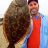Bay St Louis Mississippi angler Robert Baker hefts this nice 20inch flounder caught on Berkley Gulp