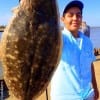Baytown angler Erik Zamora hefts this 20inch doormat flounder caught on a finger mullet