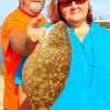 Bruce and Shirley Guillot of Batson TX show off Shirley's nice flounder she caught on a mud minnow