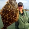 Carly Cooper of Huffman TX fished a Berkley Gulp to hook this really nice 20inch flounder