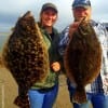 Fishin buds Carly Cooper of Huffman TX and Charles Lynch of Watanucka OK took these nice flounder on Berkley Gulp