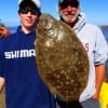 Houston angler Sam Lynch with Uncle Jackie shows off his 17inch flounder he took on a mud minnow
