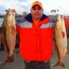 Omar Rodriquez of Houston doubled up with these 27 and 28 inch slot reds he caught on shrimp