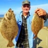 Pete Maurich of Hamshire TX shows off his 19 and 21 inch flatfish he caught on finger mullet