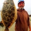 Stuart Yates of Briarcliff TX landed this nice 20inch flounder he caught on a Berkley Gulp