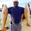 Thomas Mosley of Houston caught these two nice 24 and 27 inch slot reds on shrimp