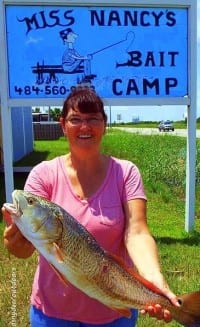 Nancy Bachman showing off her very first redfish