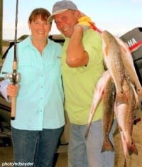 Nancy and Rick hefting our 3-angler limit of 60-plus lbs
