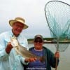 Rollover anglers Chuck Meyers holding his nice 4LB speck that Poochie Walker netted for him