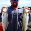 Rollover trout angler Donnie Lucier managed to finness these two nice specks by massaging the bottom with soft plastics