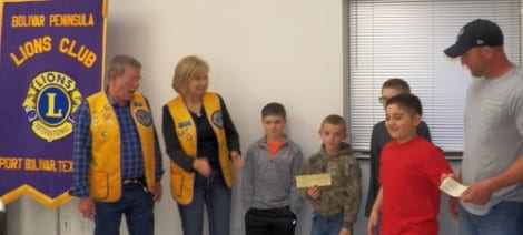 Left to right, Lions Club President Rob Byus, Lion Brenda Flanagan, team members A. J. Lowe, Gavin Lowe, Bradley Meskiet and Jordan Comeaux, team coach/manager Delino Comeaux
