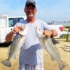 Crosby TX angler Dan Hudson shows off his 25 and 27inch specks from his trout limit of ten he took on mirrOlures and soft plastics