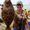 Galveston anglerette Lanae Smith hefts this nice flounder caught on a live shad