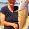 Gilchrist anglerette Neoma Smith caught this nice 28inch slot red while fishing a finger mullet