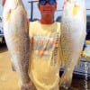 Briarcliff TX angler Stuart Yates hefts 2 of his 5 specks caught on tiger minnows
