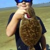 Caden Perea of Houston wade-fished Rollover bay with chicken boy soft plastic for this nice flounder