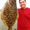 David Reyes of Pasadena TX is taking home this nice flounder he caught on live shrimp