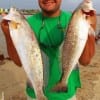 Louis Cervantis of Baytown TX worked an 808 mirrOlure in the cut to catch these 22 and 24 inch specks