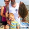 The Kojac Family shows off Jeremy's 23 inch doormat flounder caught on a speck rig while wading Rollover bay- PS- Wife Christy informed that she taught hubby  how to fish- GREAT JOB Christy