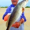 Aaayiee- the fishin's good today- yipped Rollover angler Henri Fontenot while hefting this nice speck he caught on a T-28