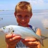 Colmesniel angler  Bryce Broom shows off his Bluefish he took on a mud minnow