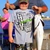 Dad Cody Donahue with son Remi teamed to catch this 36inch tagger bull red dad took on live shad