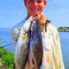 Dalton Vrana of Houston tethered up these nice trout and reds he caught on live shrimp