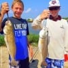 Fishin pals  Scott Low and Brayton Baber of Cypress TX  doubled thier fun with these two nice slot reds caught on shrimp