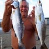 High Islander Dennis the Menace waded the 6am surf to fetch these two nice trout on plastic
