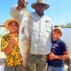 Houston Angler Mathew Bowie worked a H2O Croaker to catch this 26inch gator-trout as nephews Davd and Daniel give him a thumbs up
