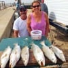 Mike and Nora Therrell of Point Blank TX show off some of there box of specks they caught on Fathers Day