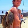 Saul Martinez of Galveston TX waded Rollover Bay with finger mullet to fetch his 5 flounder limit