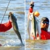 Surf wader O'Neal hefting up his stringer of surf specks he caught on a -BLEEP-
