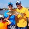 The Bostian family of Nacogdoches TX applaud Jake Bostian's redfish catch he took on live shad