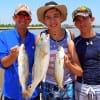 The Three Fish-Ka-Teers of Katy TX show off thier catch they caught on assassins