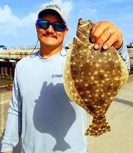 Beaumont angler Joe Bryan shows off one of his flounder he took on a Hogan-R