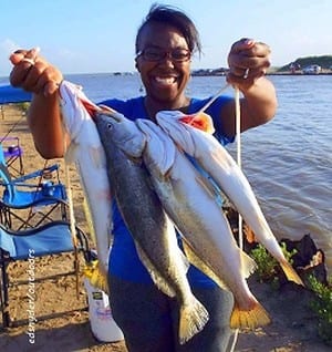 Erica Jones of Humble TX fished the 12AM to 1AM tide on the night shift with soft plastics to nab these nice trout