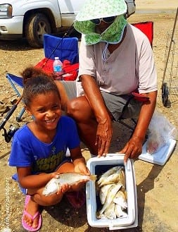 Galveston  Islanders Candace and Nadia Cannon had fun filling their cooler with croaker they caught on shrimp