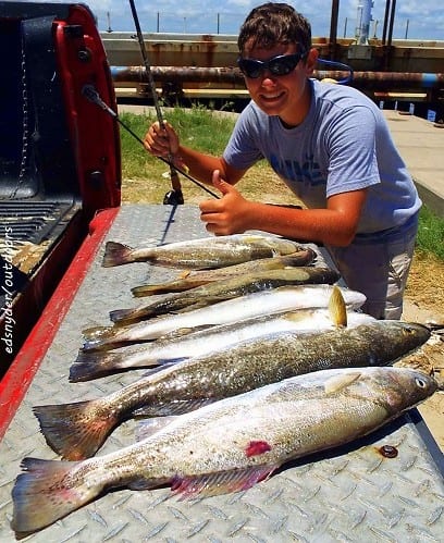 Liberty TX angler Dylan Balch worked soft plastics on the gulf side of the bridge to tailgate this near limit of trout