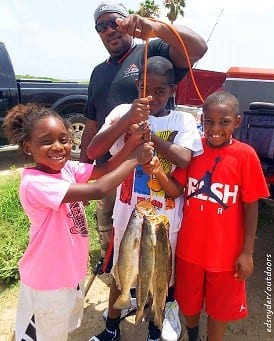 The Brookins Family of Porter TX had fun helping daddy with this fine stringer of trout