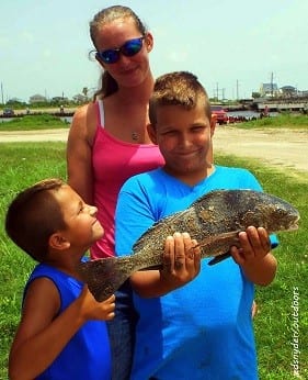 The Hindman Family of Crystal Beach TX gives a big thumbs up for Gabe's nice keeper eater drum he took on Miss Nancy's shrimp