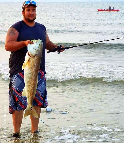Baytown angler John Diaz waded the surf with a chicken boy soft plastic to land this HUGE 39inch bull tagger red