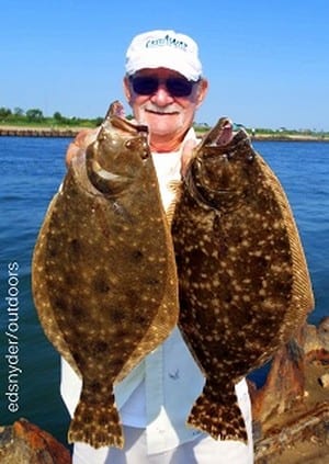 Burgess Gatlin of Trinity TX  took these two nice flounder while fishing finger mullet