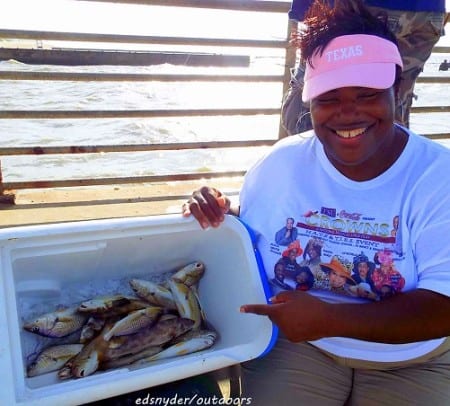 Croaker and Whiting time at the Pass as Houston anglerette Gwen Price shows off her supper she caught on shrimp