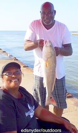 Gwendolin Bridges of Houston shows off this nice slot red caught on a finger mullet