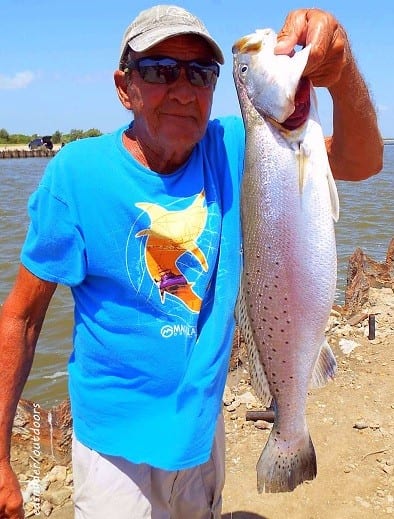 Two time trout wrangler Bob -Rollover- Goodman shows off one of his two 22inch specks he caught on finger mullet
