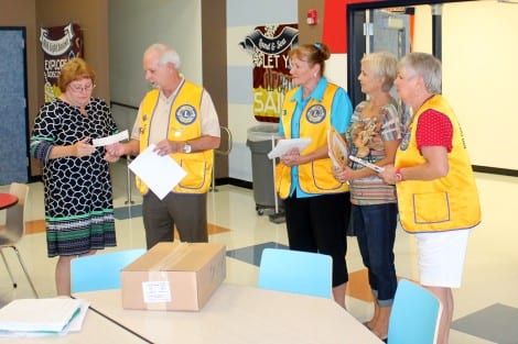 Lions Club Vice-President Franks Chambers presenting a check to Annette Dailey, Principal of Crenshaw School. Also pictured are Lions Club members Kathy Hammond, Brenda Flanagan and Charlotte Byus.